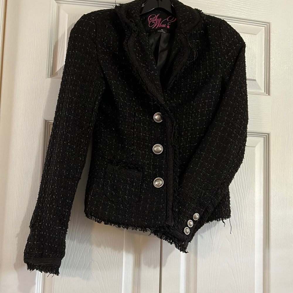 Black short tweed jacket, raw hem, brushed pewter buttons.